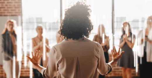 Women presenting infront of cowokers