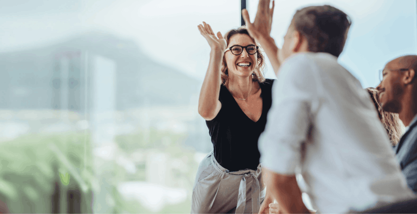 Men and women high-five